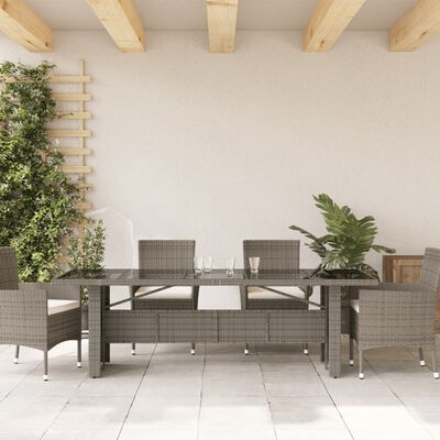 vidaXL Zahradní stůl se skleněnou deskou šedý 240x90x75 cm polyratan