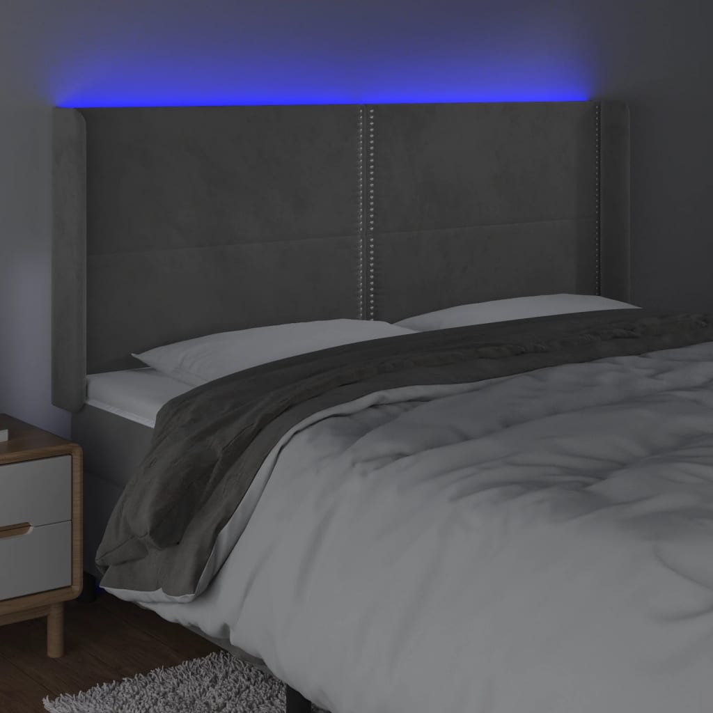 vidaXL Čelo postele s LED světle šedé 203 x 16 x 118/128 cm samet